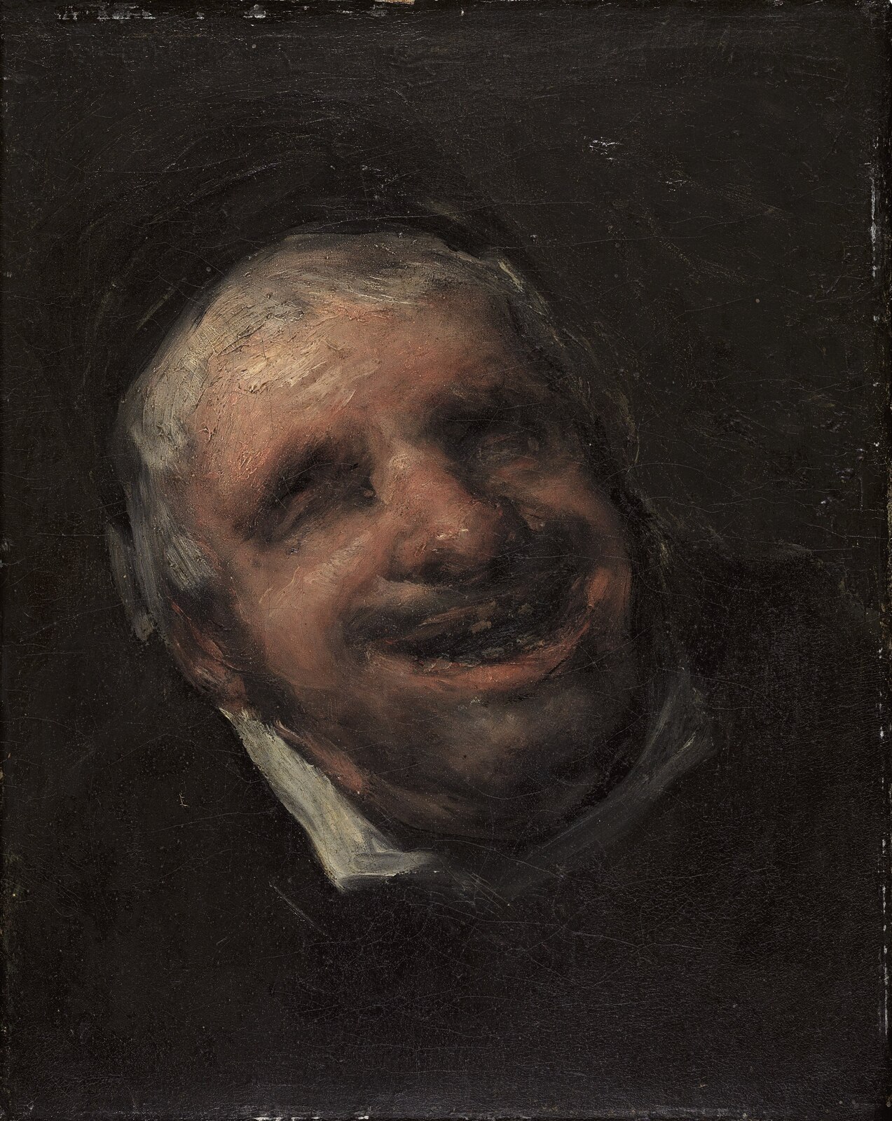 Retrato de El Tío Paquete, sonriente, emergiendo de un fondo oscuro